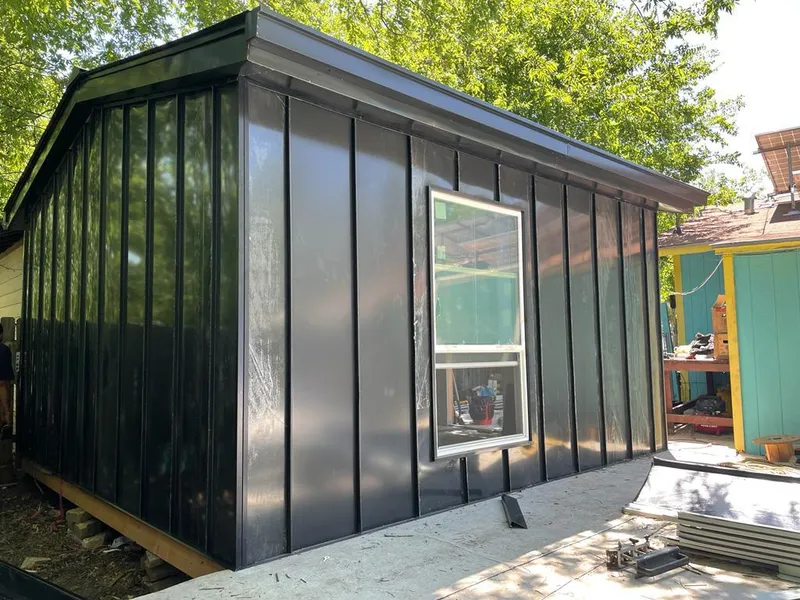 Black standing seam metal wall panels for Roof Inspection in Victoria